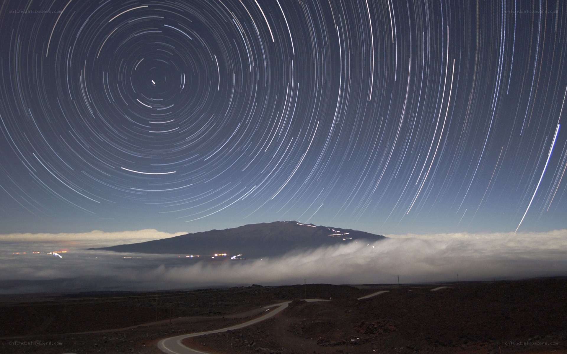 Star trails over mountain landscape