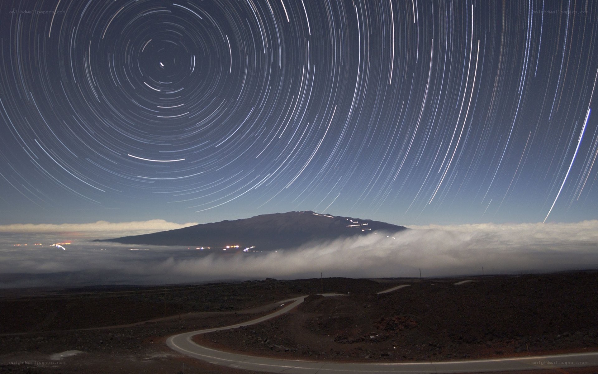 Star trails over mountain landscape