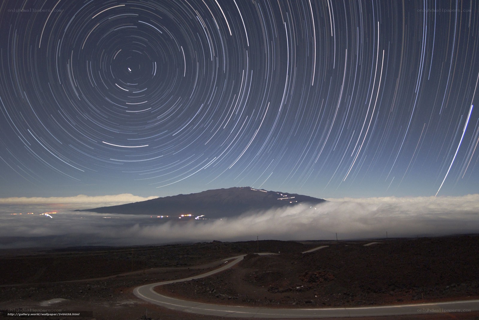 Star trails over mountain landscape