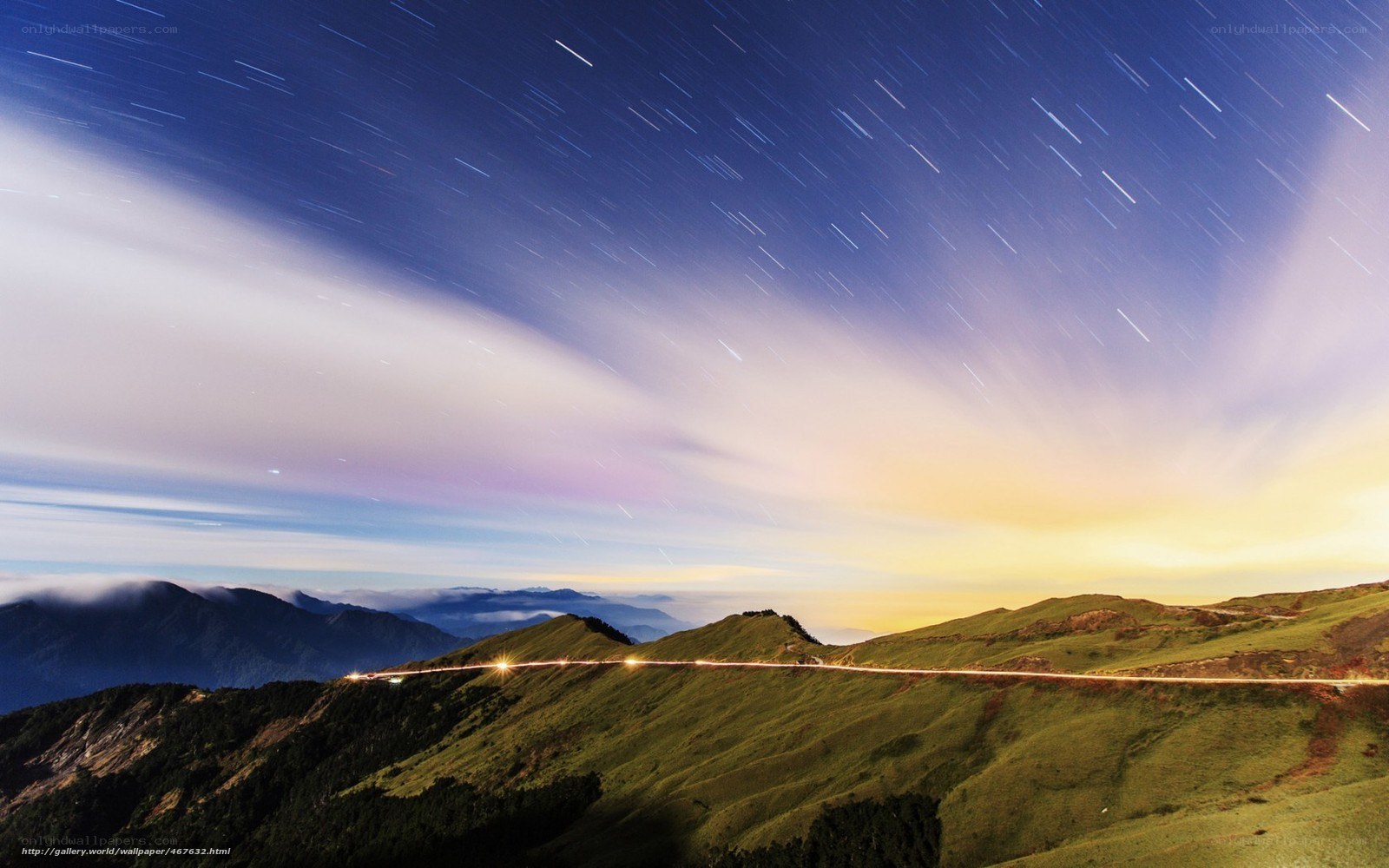 Star trails over mountain ridge