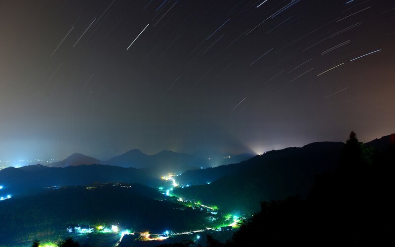 Star Trails over Mountains — Black, Serene