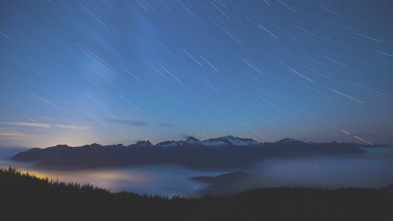 Star Trails over Mountains — Blue, Serene, Night, Photograph, Clouds, Forests