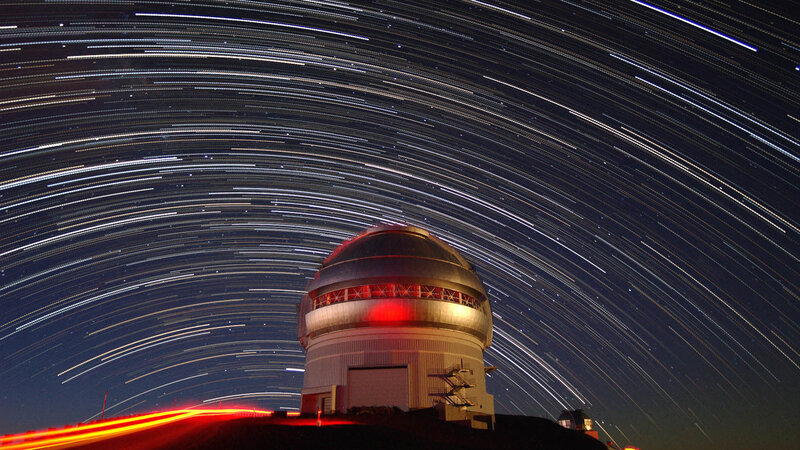 Star trails over observatory dome