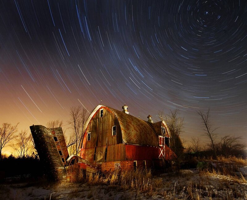 Star trails over old barn