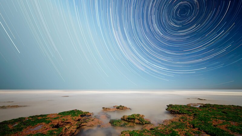 Star Trails over Rocky Shore — Blue, Serene