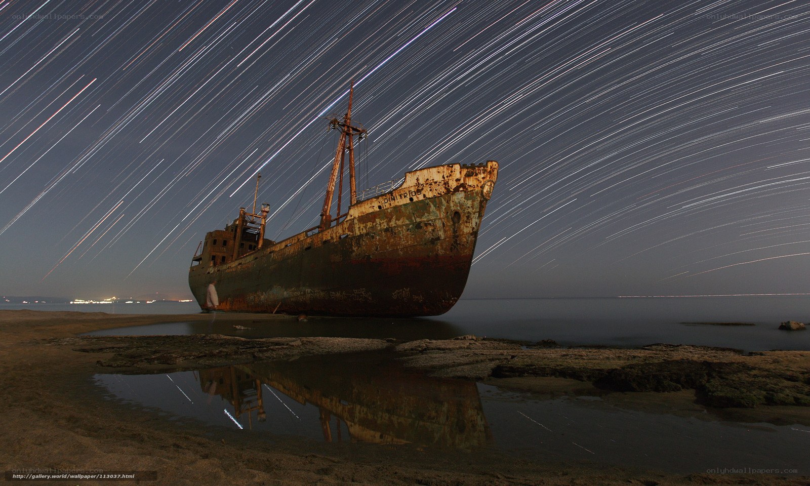 Star trails over shipwreck