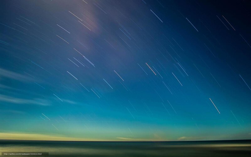 Star trails over the ocean