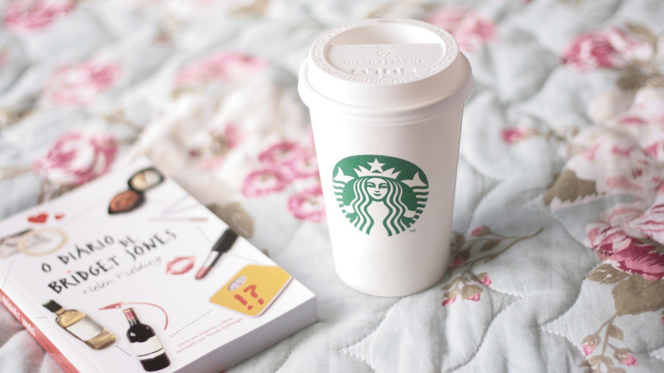 Starbucks coffee with a book
