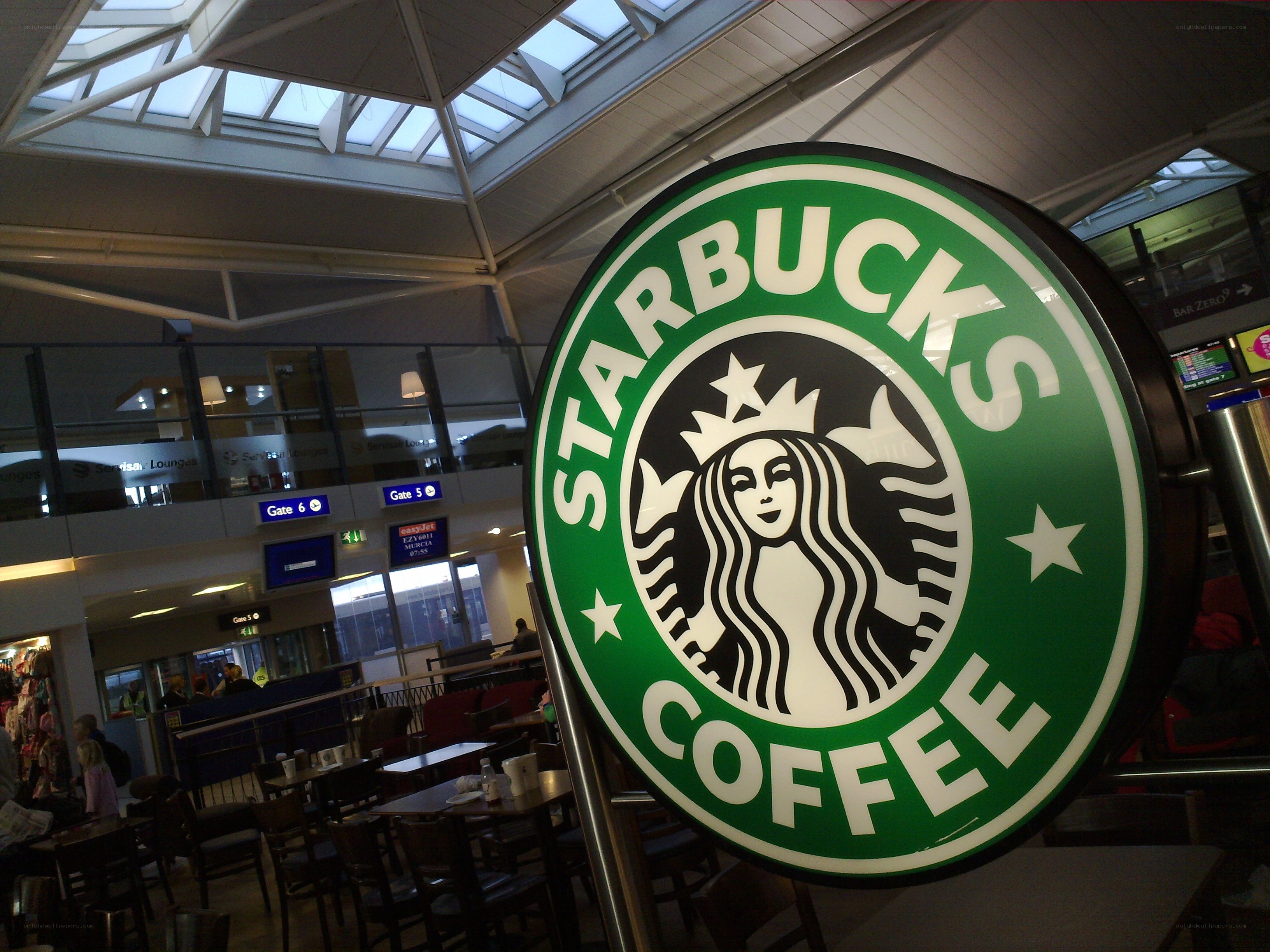Starbucks sign in airport terminal