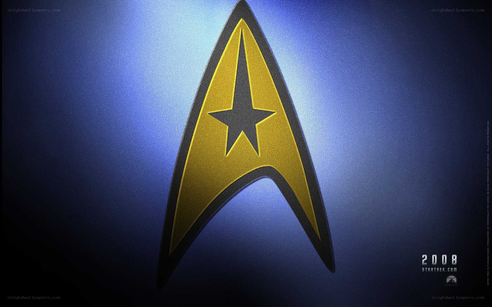 Starfleet insignia on blue background