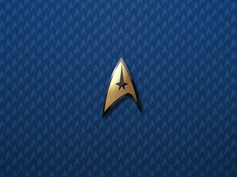 Starfleet insignia on blue pattern