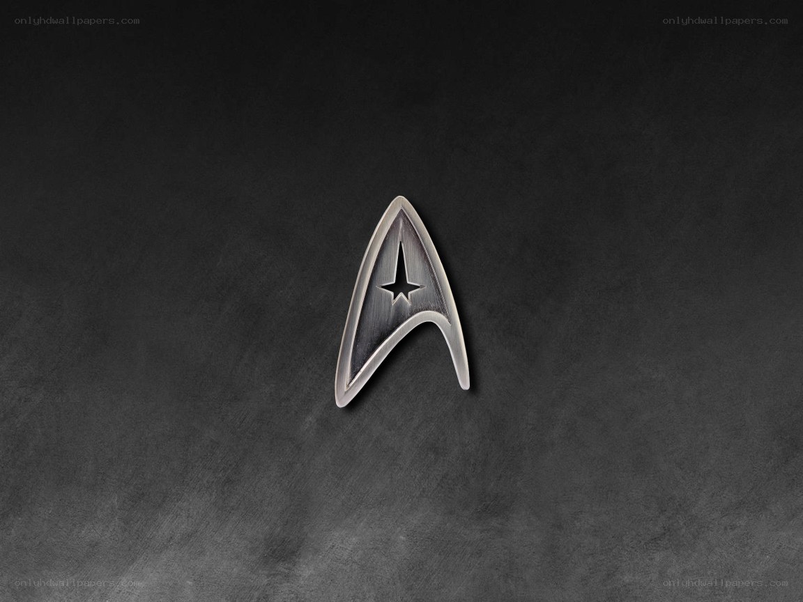 Starfleet insignia on dark background