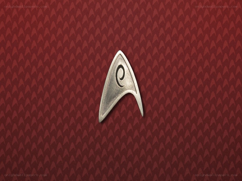 Starfleet insignia on red background