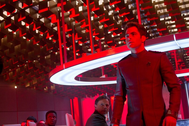 Starfleet officers in a red-lit room