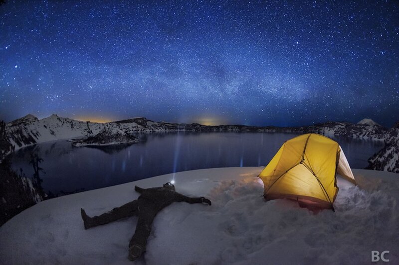 Stargazing by a snowy lake
