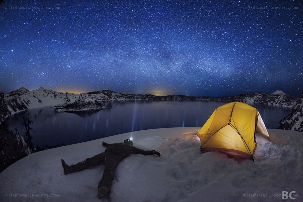 Stargazing by a snowy lake