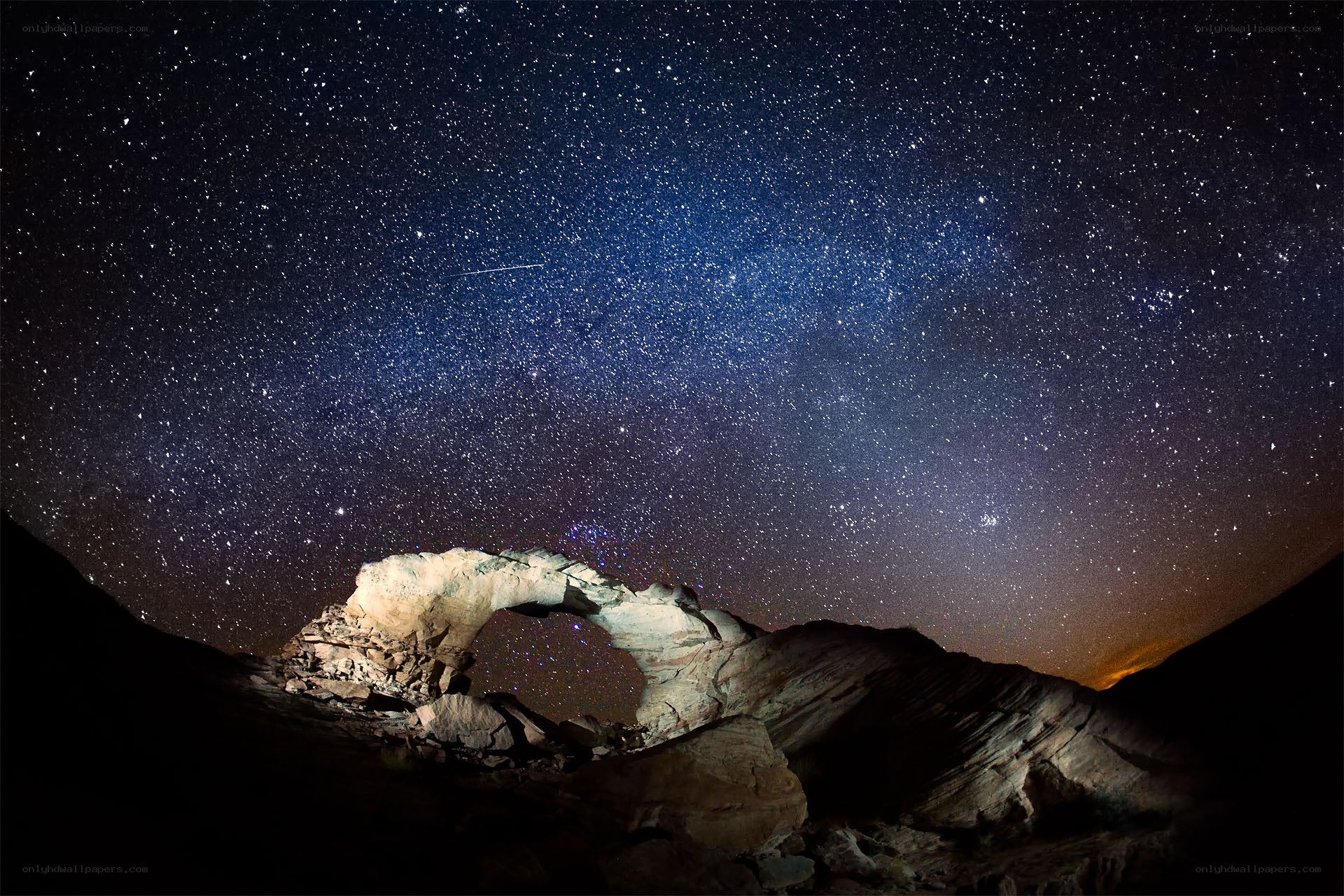 Starlit arch under night sky