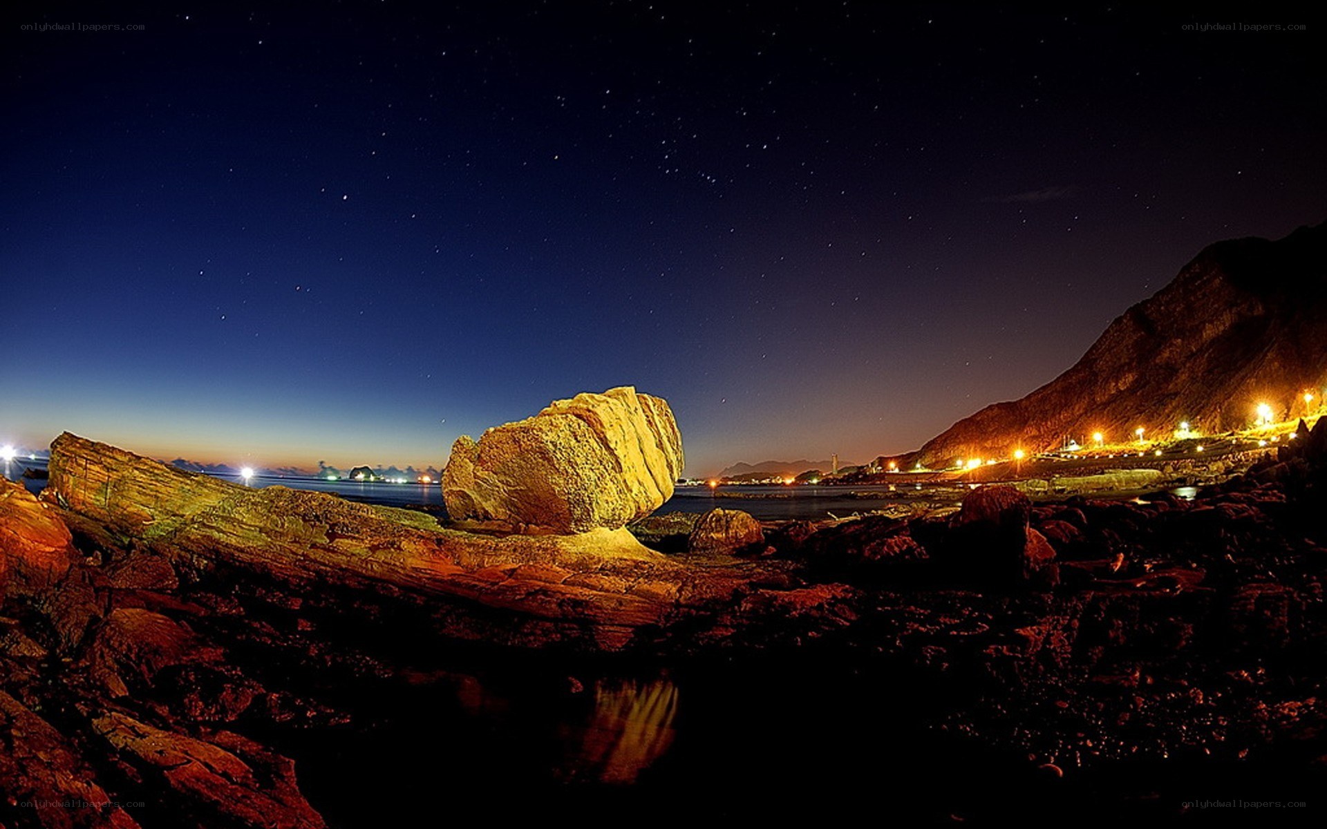 Starlit coastal rock formation
