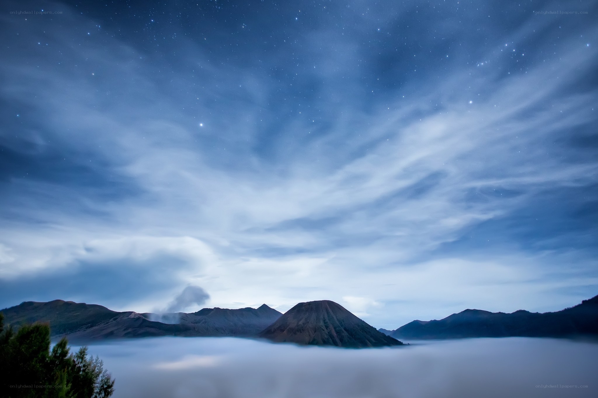 Starlit mountain landscape at dawn
