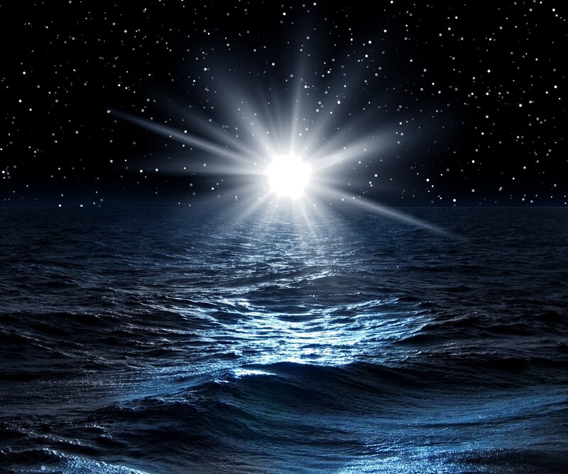 Starlit ocean at night