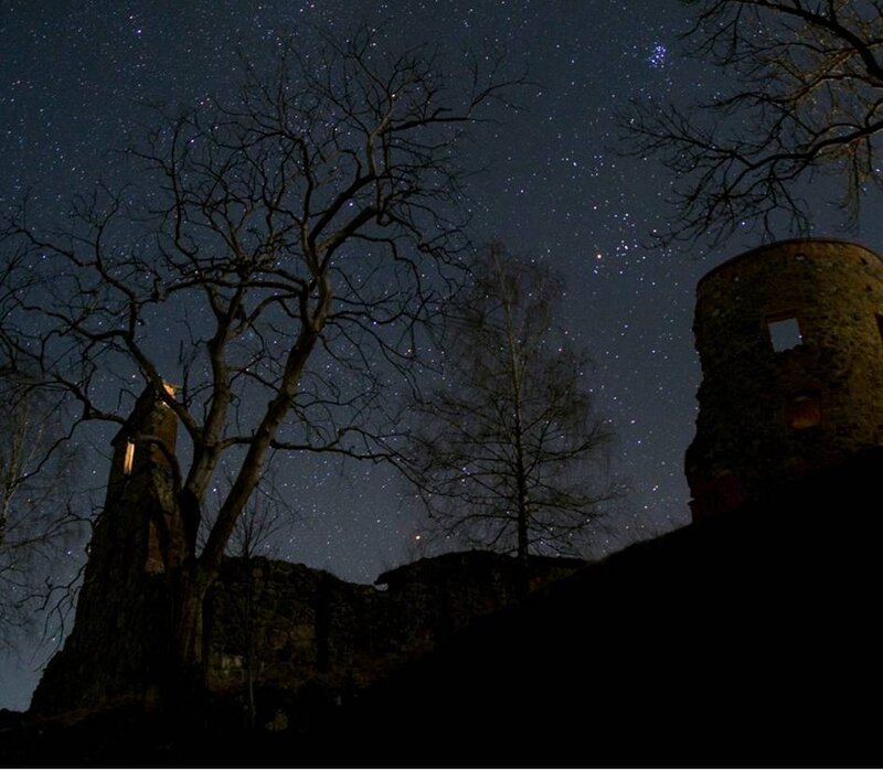 Starlit ruins at night