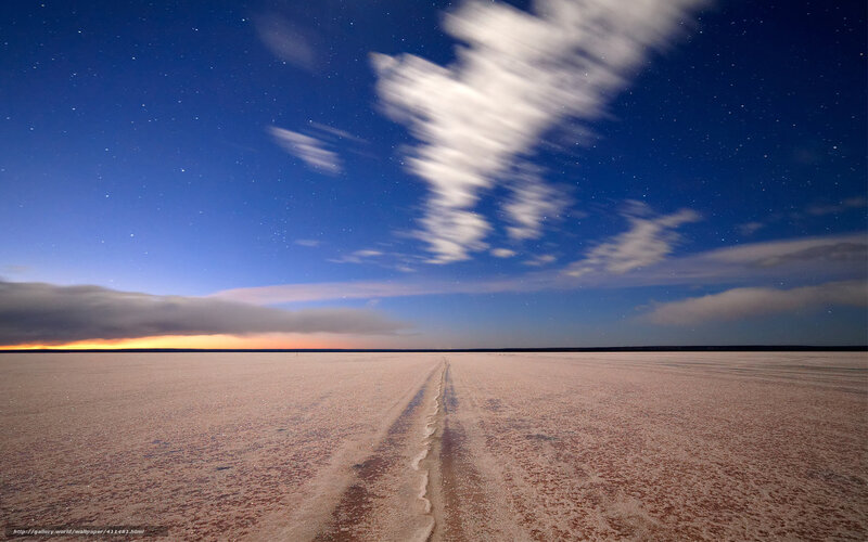 Starlit salt flat at night