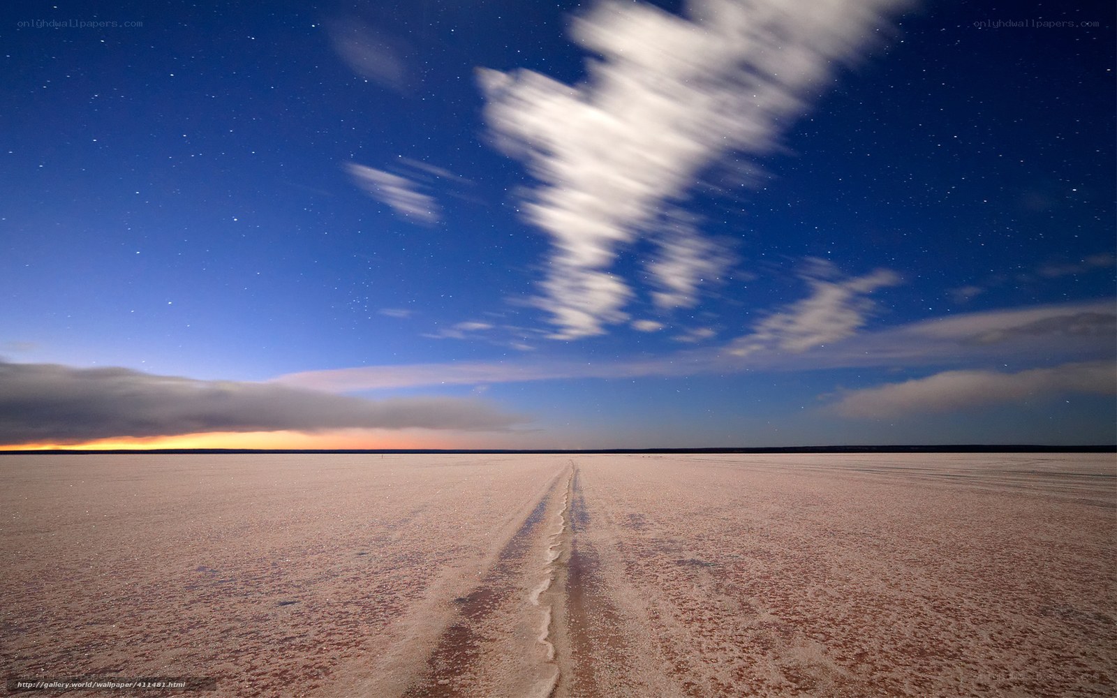 Starlit salt flat at night