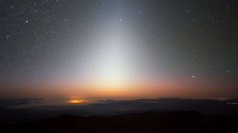 Starlit sky over mountain peaks
