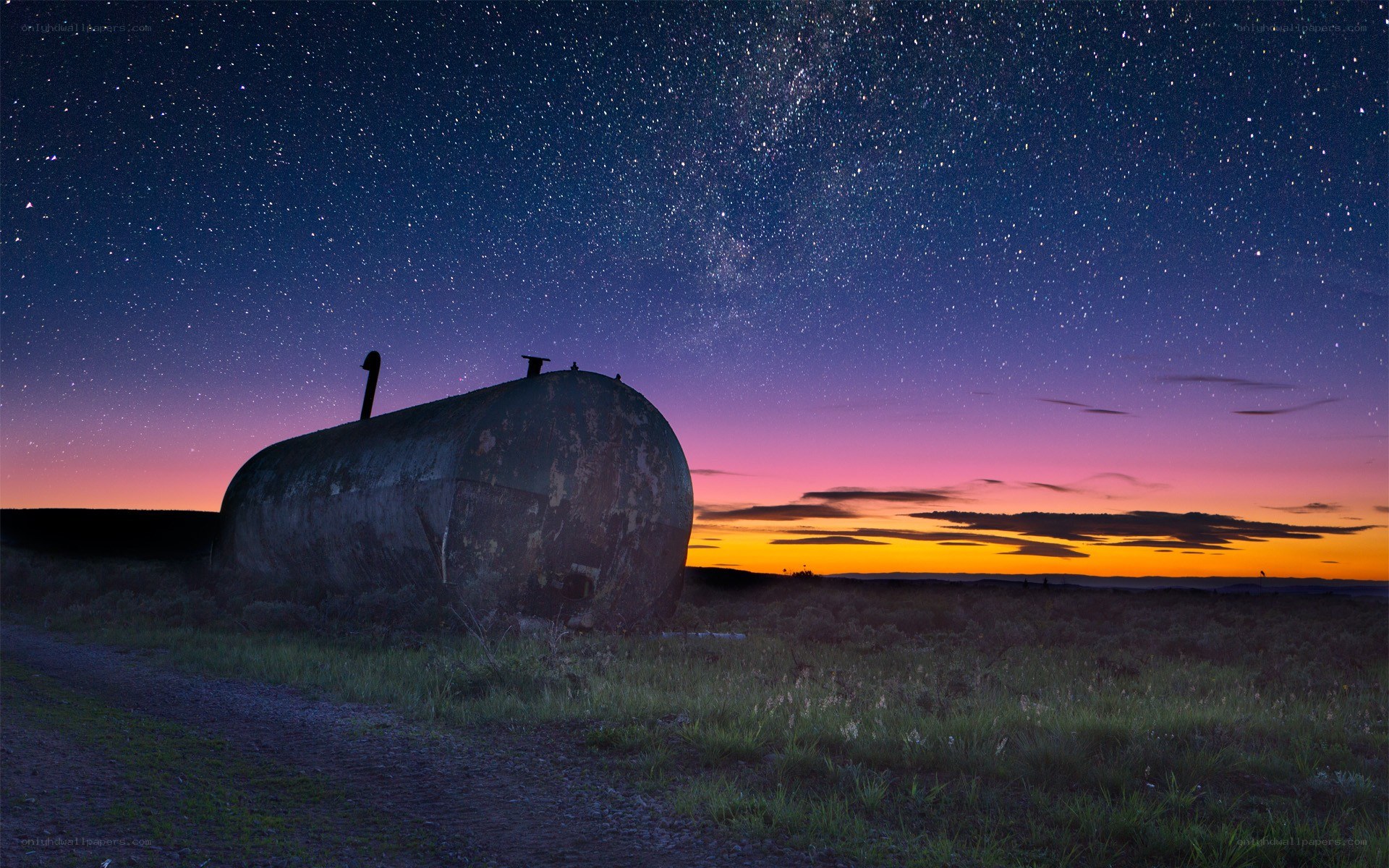 Starlit sky over old tank