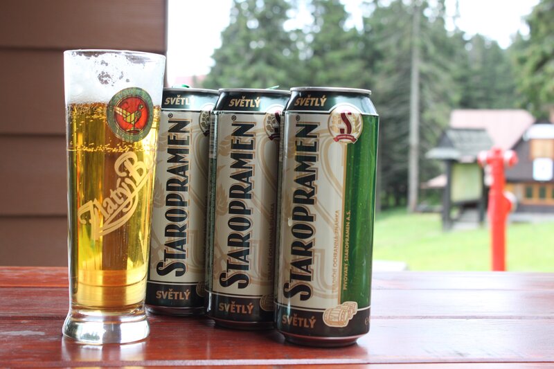 Staropramen beer cans and glass