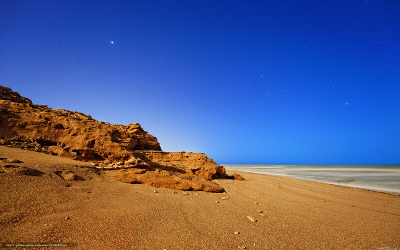 Starry night at desert beach