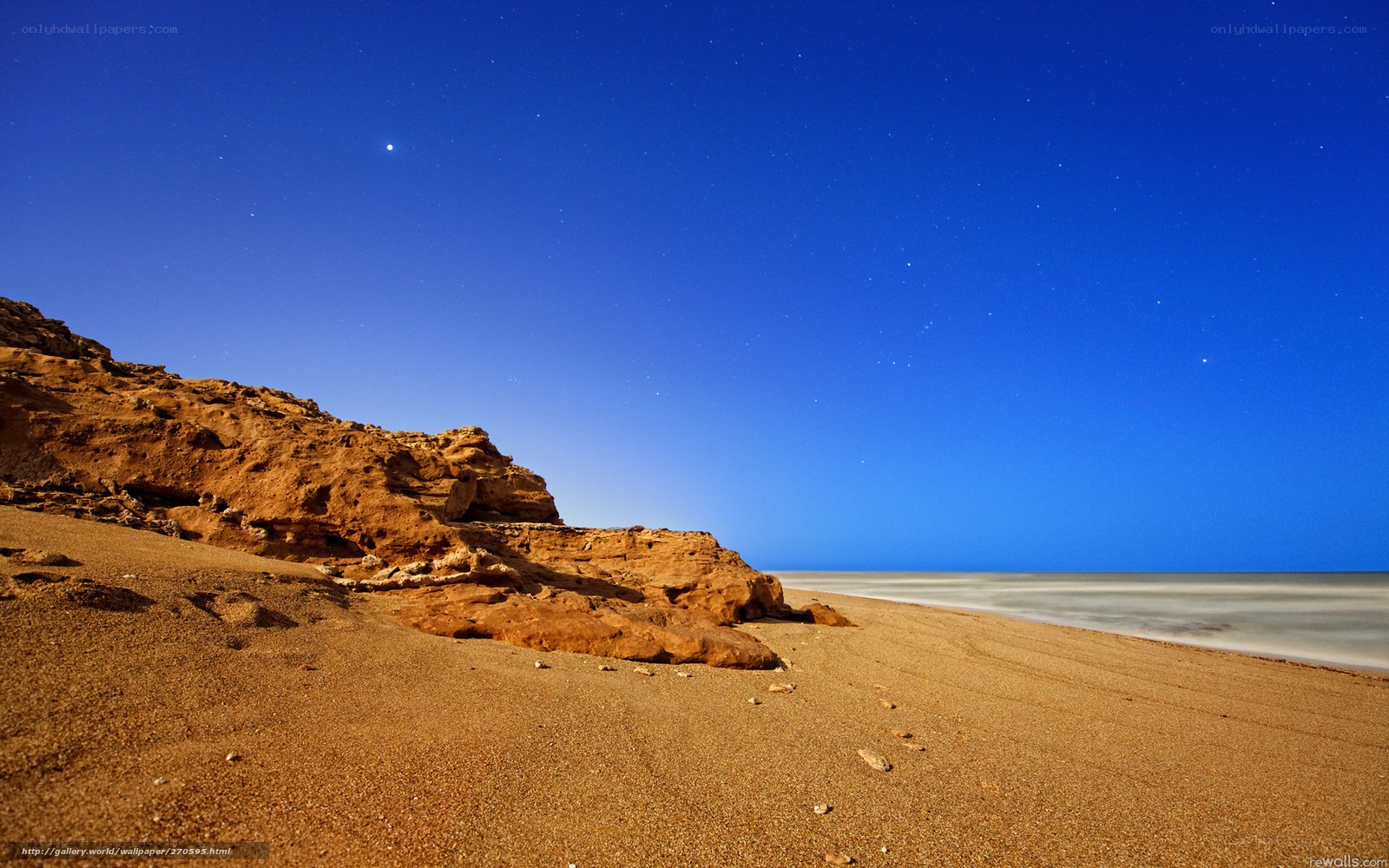 Starry night at desert beach