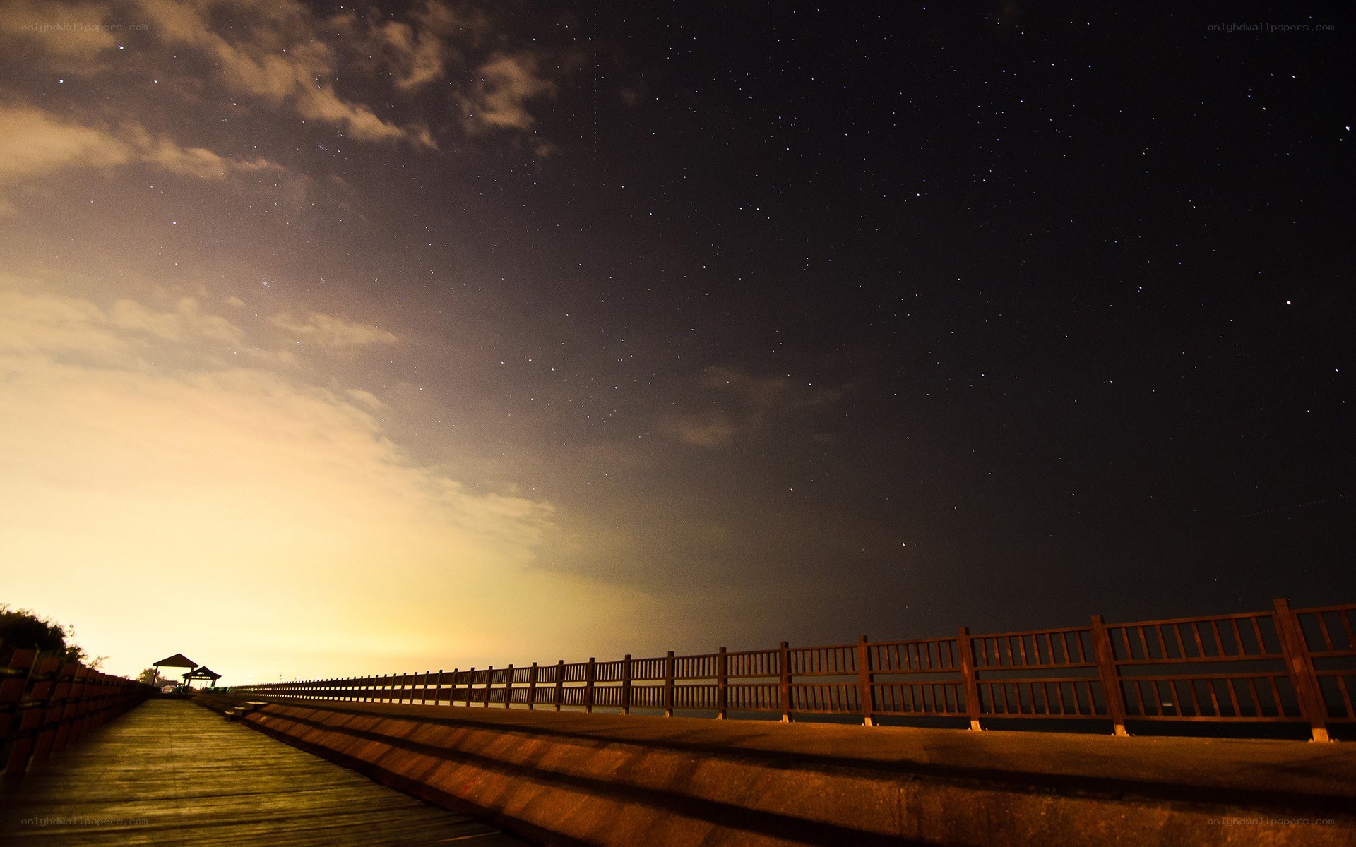 Starry night over a boardwalk