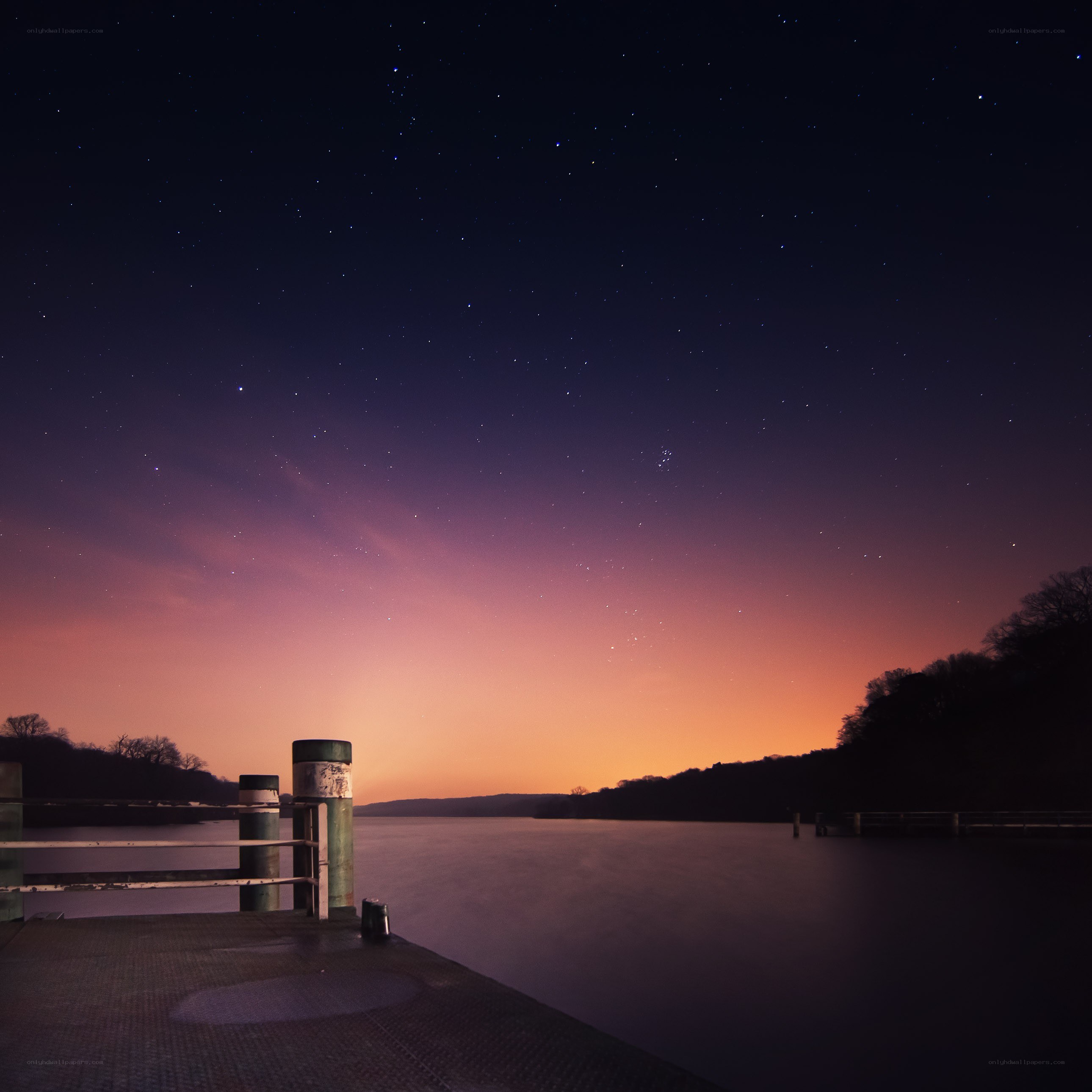 Starry night over a calm river