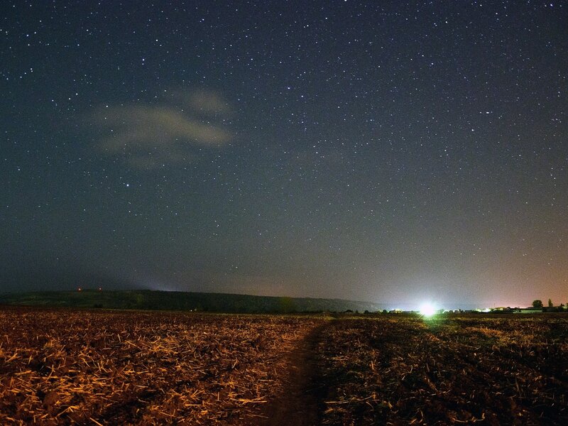 Starry night over a plowed field
