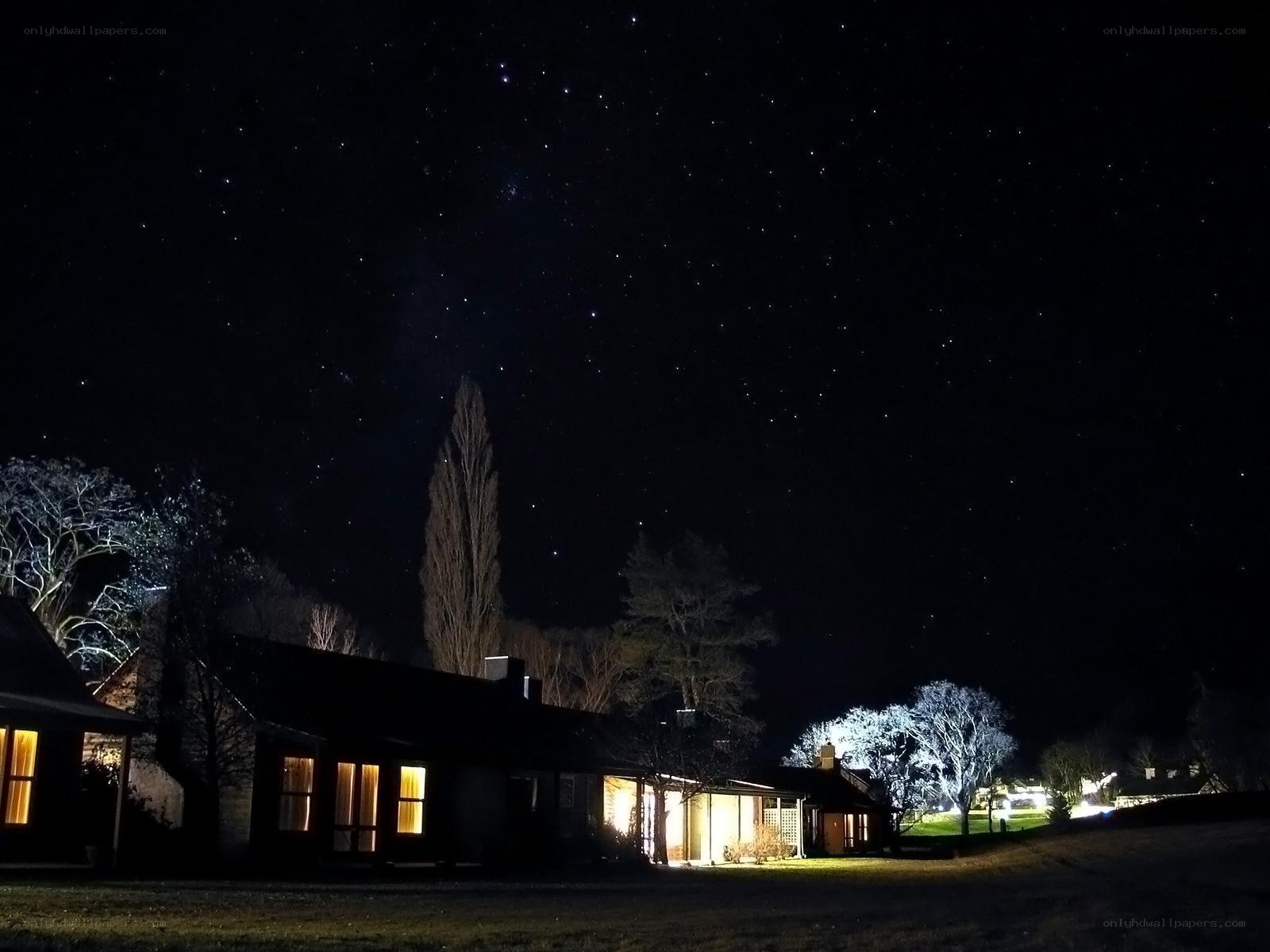 Starry night over a quiet house