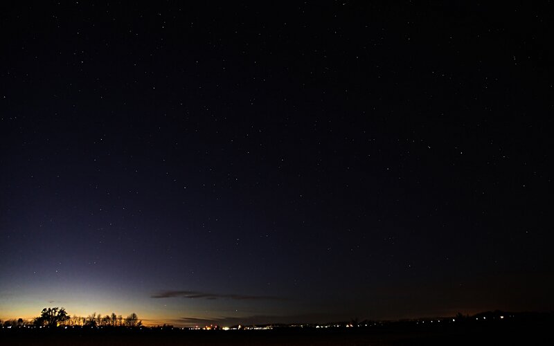 Starry night over a quiet landscape
