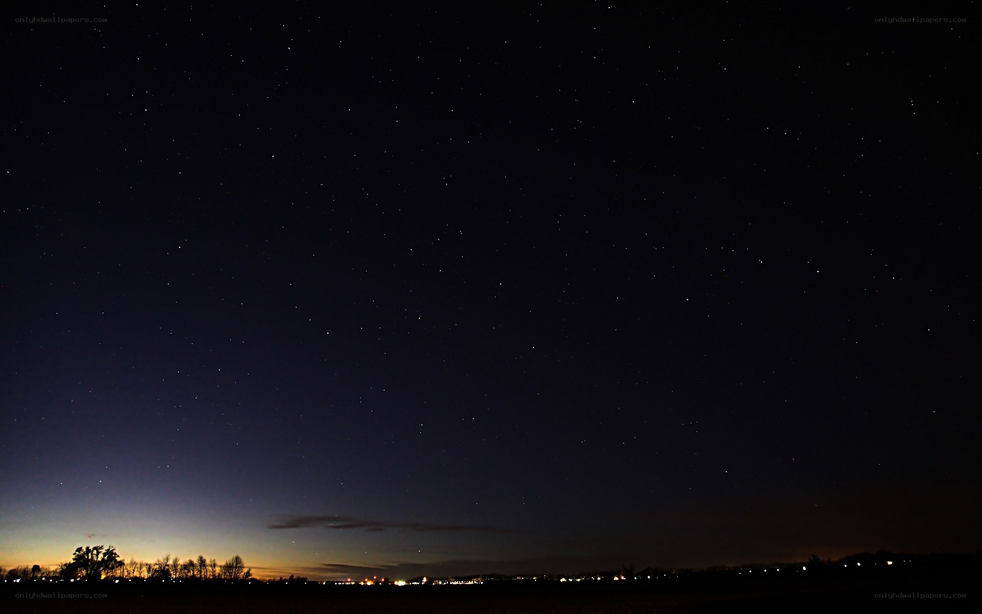 Starry night over a quiet landscape