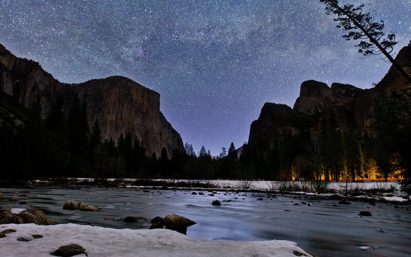 Starry night over a snowy river