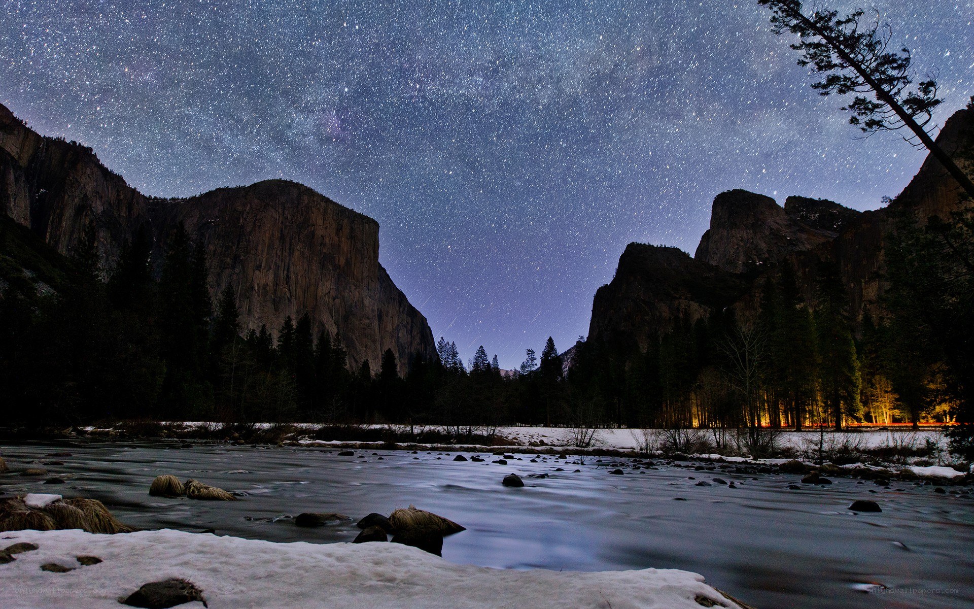 Starry night over a snowy river