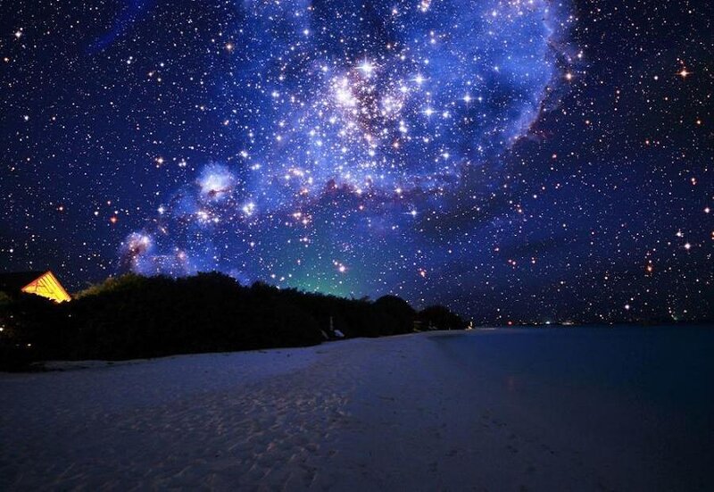 Starry night over a tropical beach