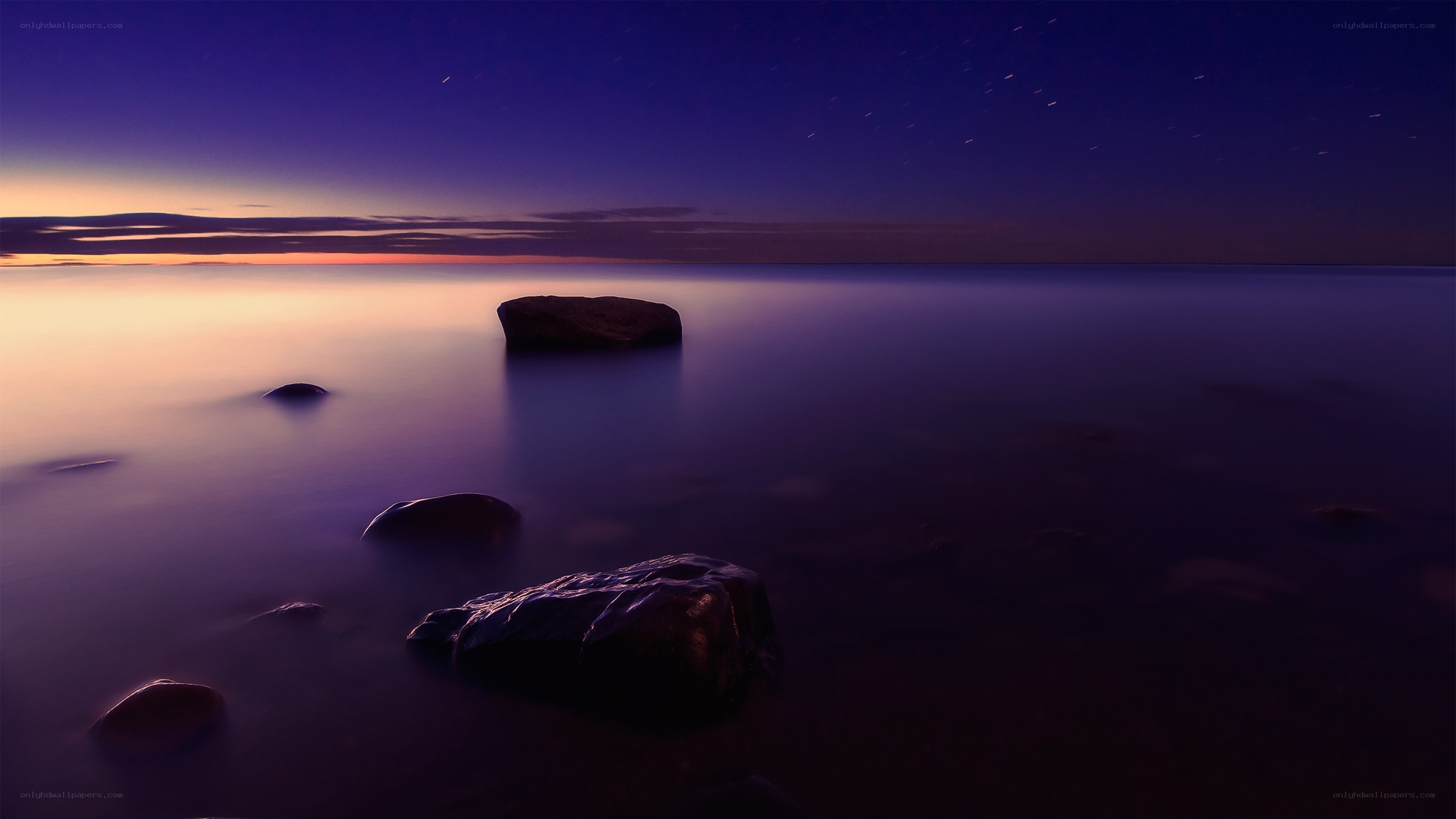Starry night over calm sea