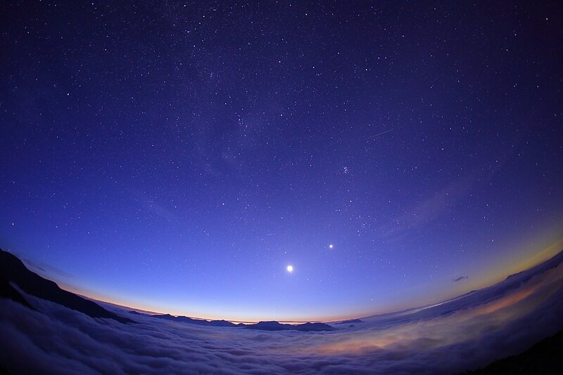 Starry night over clouds