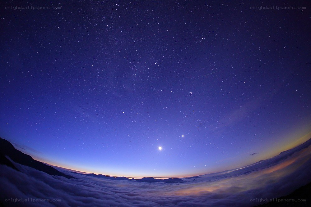 Starry night over clouds