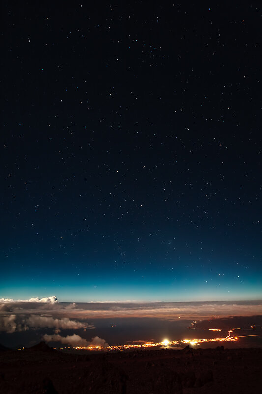 Starry night over coastal city