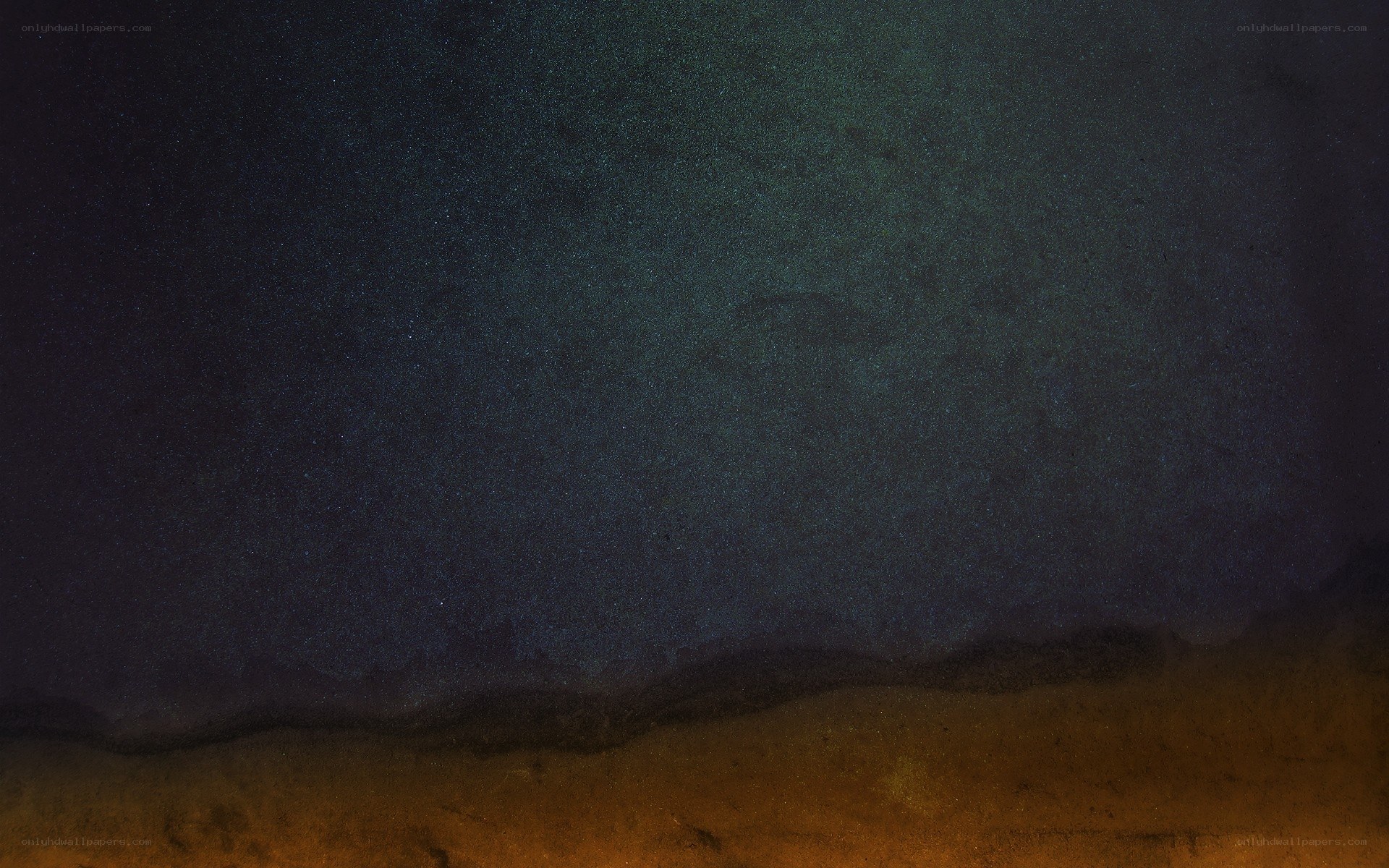 Starry night over dark landscape