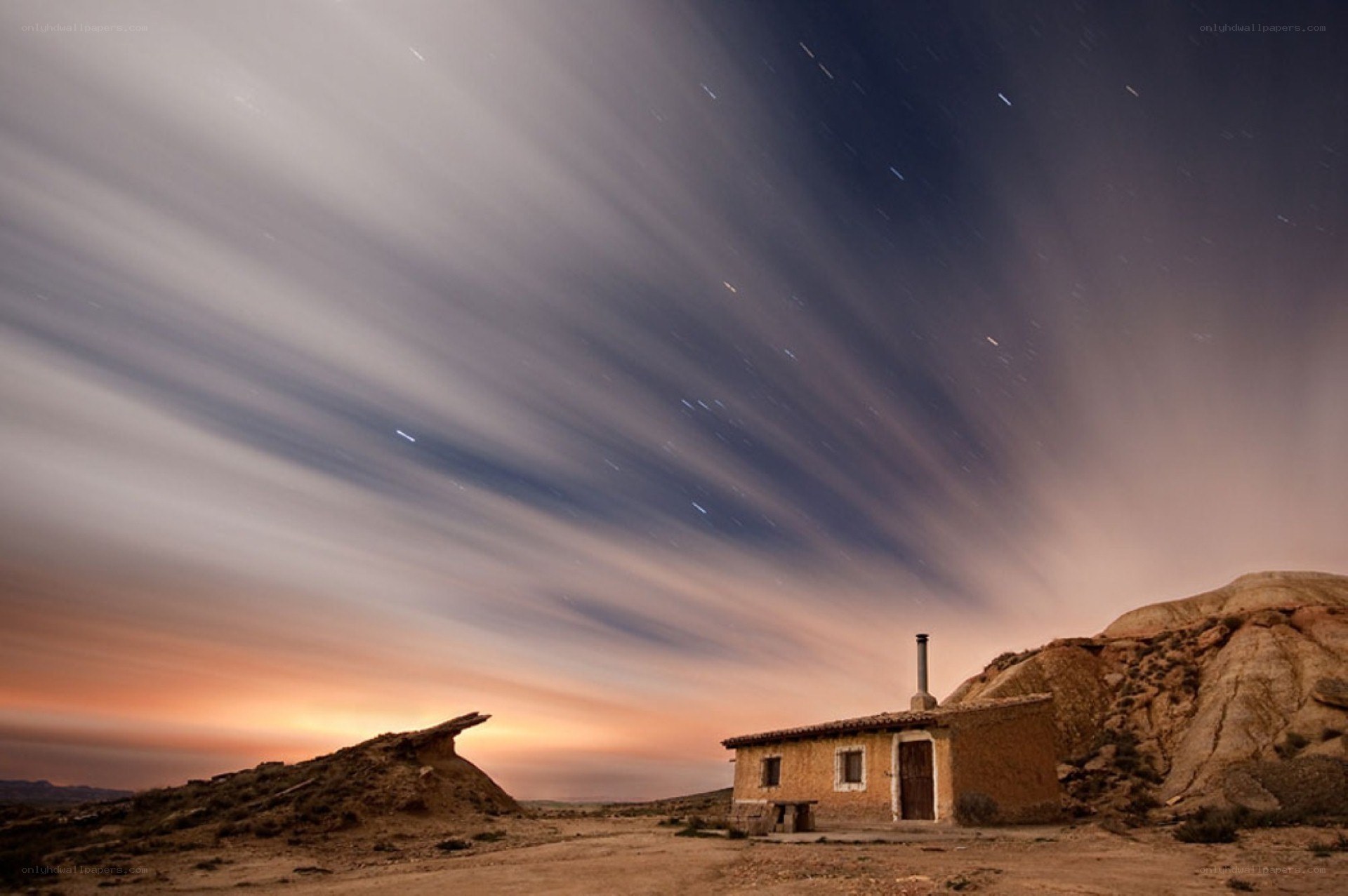 Starry night over desert hut