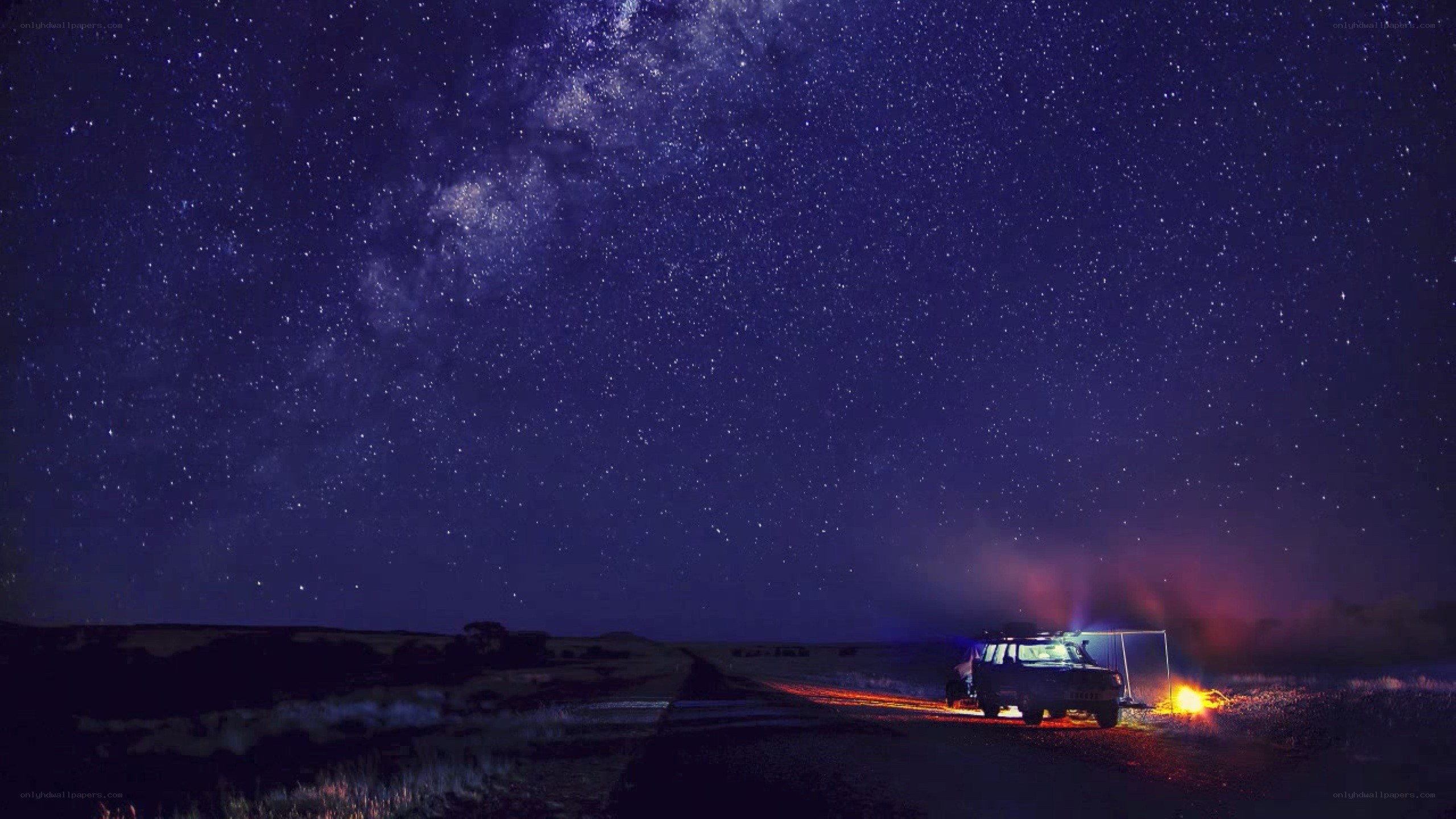 Starry night over desert road