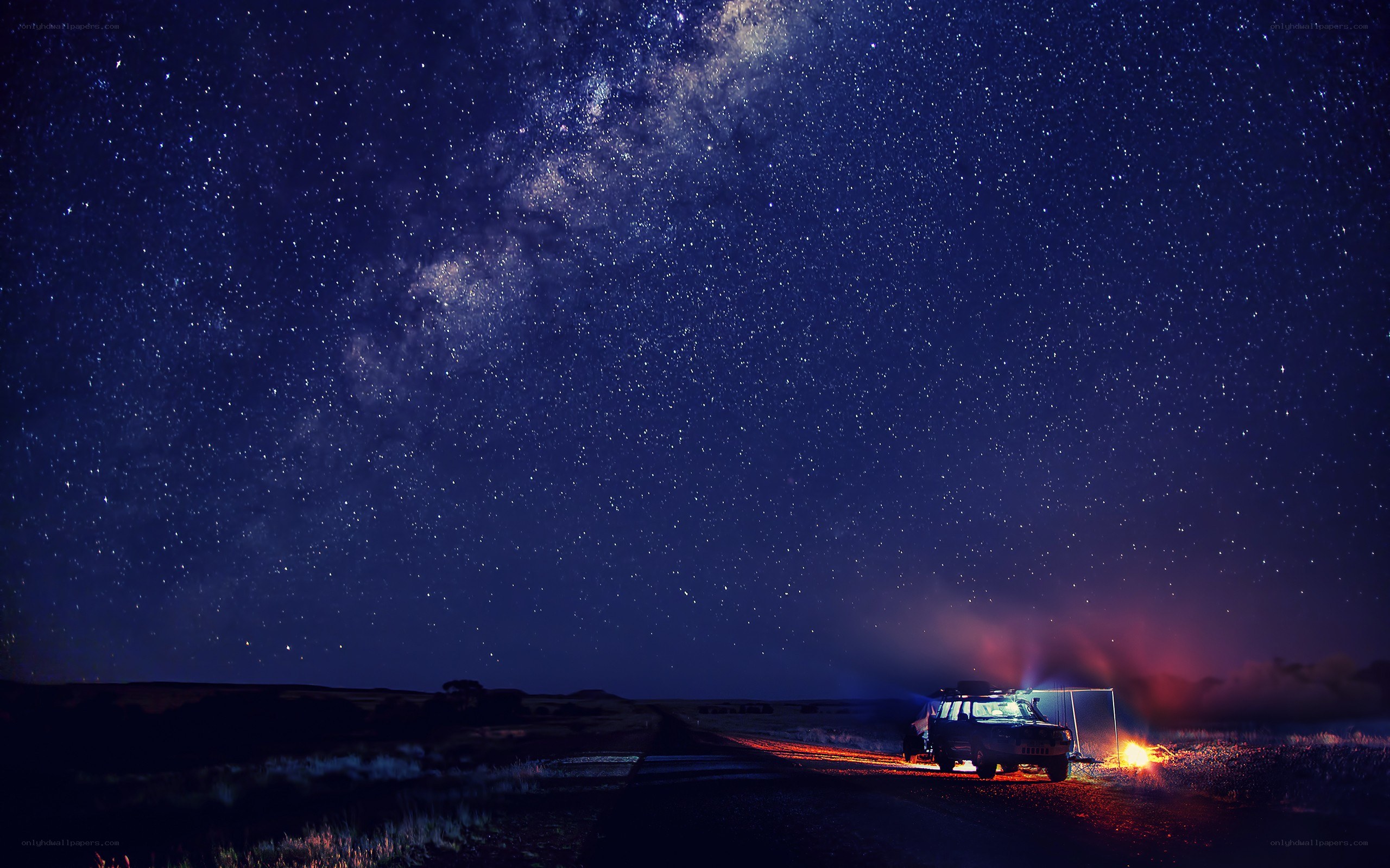 Starry night over desert road