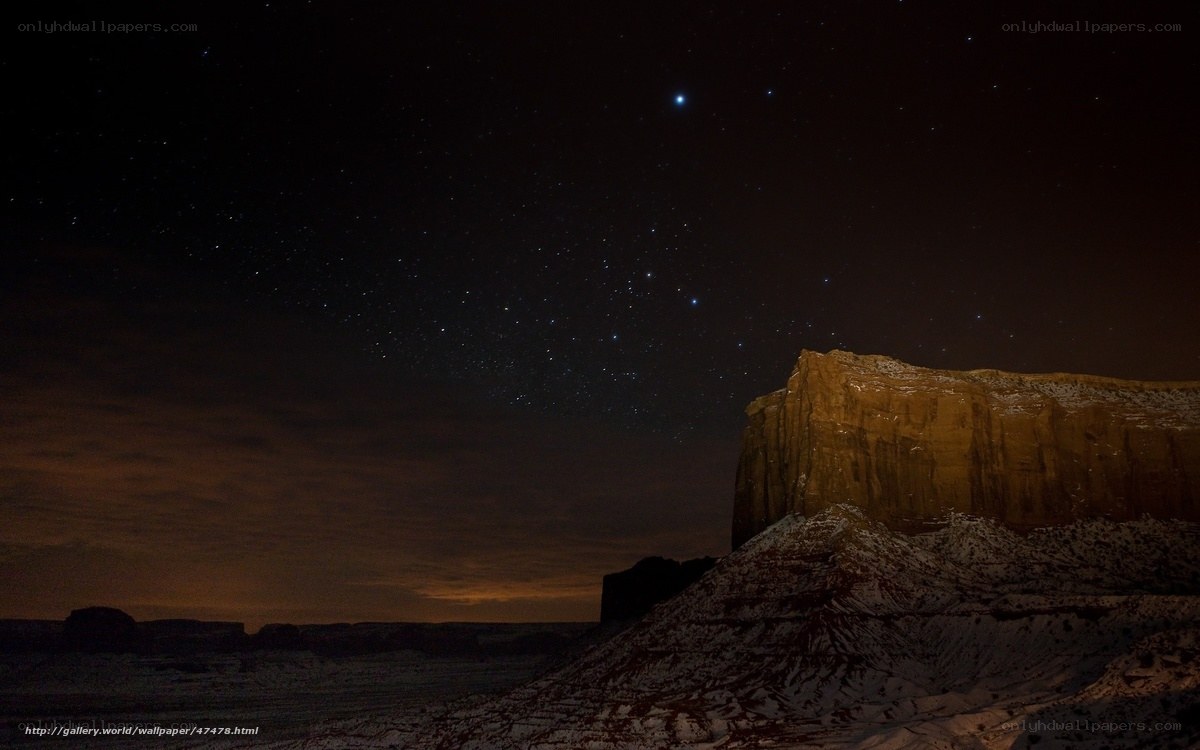 Starry night over desert rock